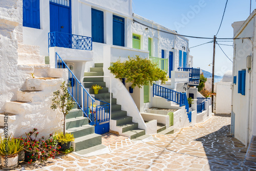 Narrow streets with typical Greek style architecture in Kimolos village, Kimolos island, Cyclades, Greece photo