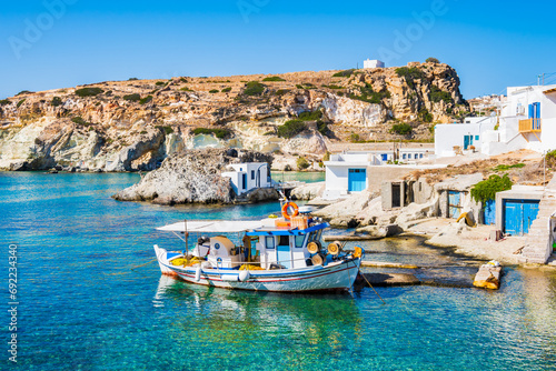 Fototapeta Naklejka Na Ścianę i Meble -  Fishing boat at Rema beach in beautiful sea bay, Kimolos island, Cyclades, Greece