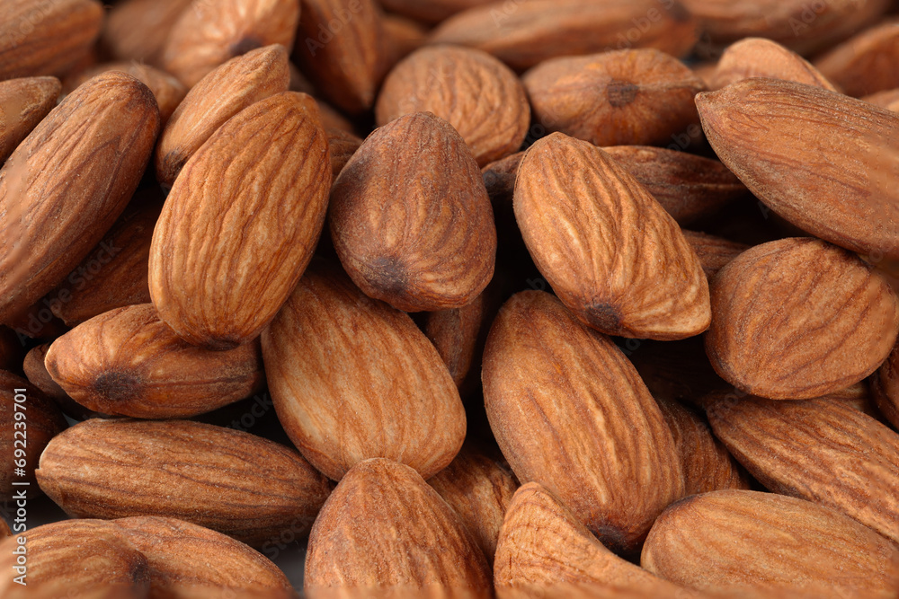 Dried almonds. Almond background. A pile of dry nuts in full frame Dried almonds. Almond background. A pile of dry nuts in full frame