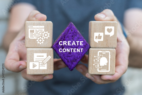 Man holding blocks with icons sees inscription: CREATE CONTENT. Business people use internet technology to study on smartphone and computer digital marketing concepts create content on social media.