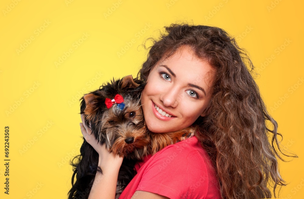 Happy woman hold cute dog in hands Happy woman hold cute dog in hands