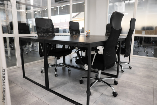 Comfortable office chairs and tables in meeting room