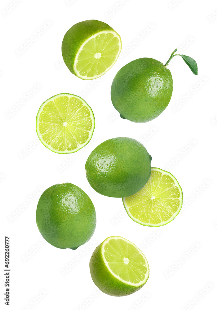 Fresh ripe limes falling on white background