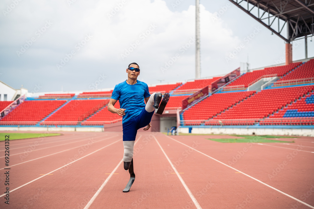 Fototapeta premium Portrait of Asian para-athletes disabled with prosthetic in stadium. 