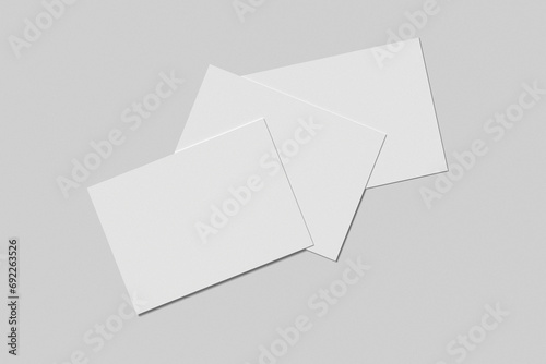 Top view of paper mockup on gray background. Can be a brochure, flyer, poster, planner, and so on 