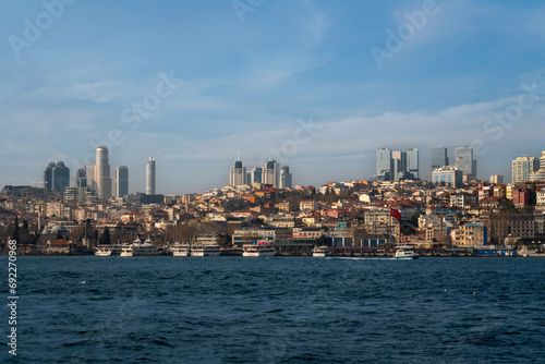 View of the Besiktas Pier on the European shore of the Bosphorus Strait and the Sinan Pasha Mosque on a sunny day, Istanbul, Turkey © Ula Ulachka