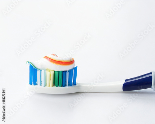 Toothbrush with toothpaste on white background