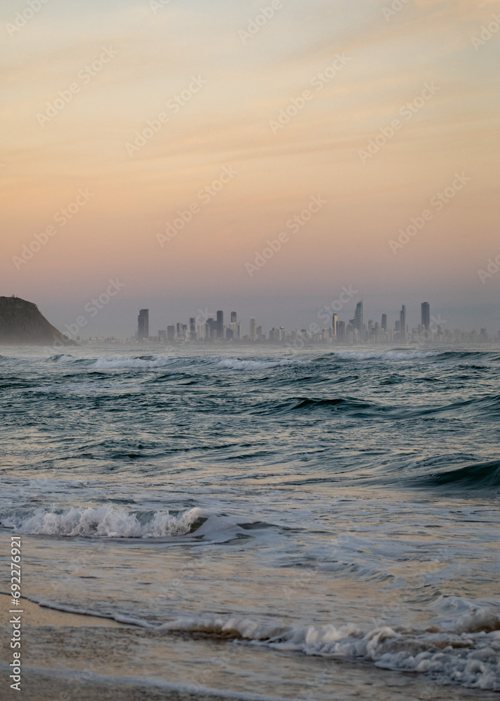 The Gold Coast Skyline in Australia from a Beach at Sunrise