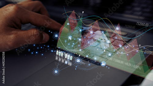 Businessman or data scientist working on laptop with business dash board analytics chart metrics KPI to analyze the performance and create insign reports of business management. Data science concept.
