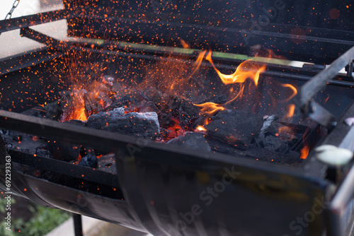Photograph of charcoal grill ignited. Food preparation concept.
