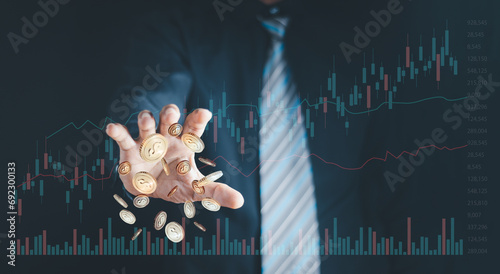 investment and finance concept, businessman holding virtual trading graph and blurred coins on hand, stock market, profits and business growth. photo