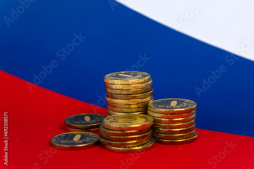 stacks of coins on the background of flag Russian Federation