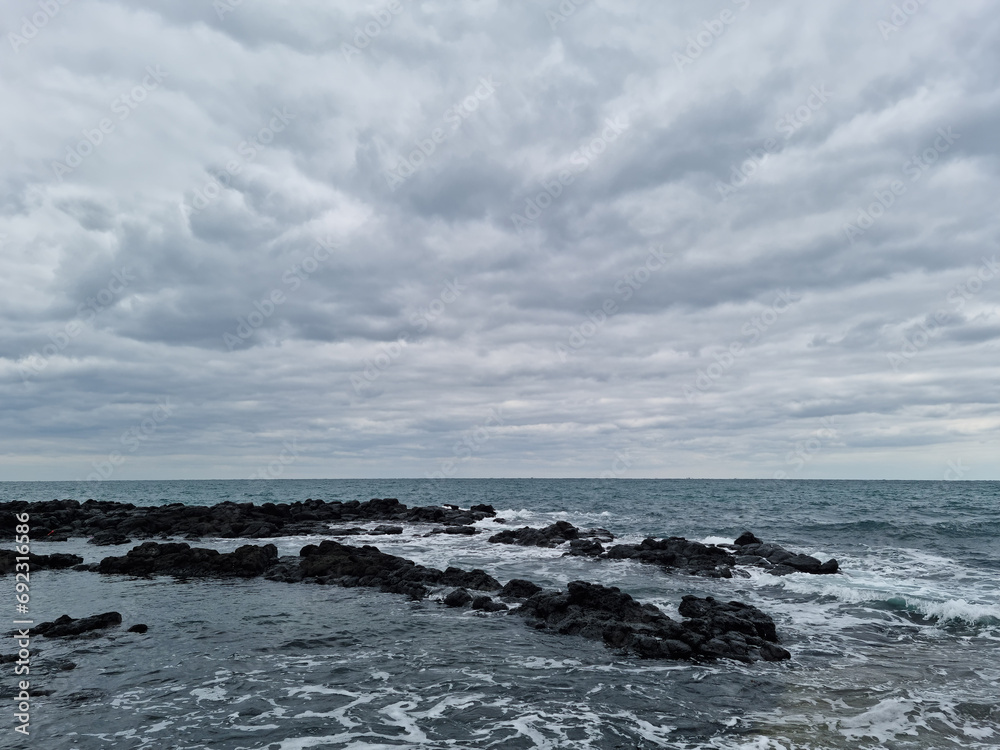 This is a Jeju Island beach with basalt rocks.
