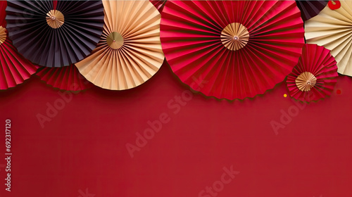 Red and gold paper fan garlands on a red background suitable for Chinese New Year decorations  festive event invitations  party posters  and holiday-themed designs.copy space for text