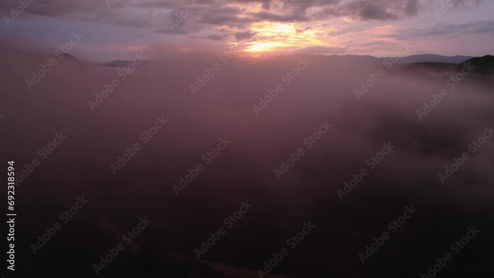 Amazing view of sunset and misty hills Amazing view of sunset and misty hills
