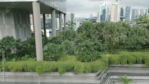 Close-up aerial of a green high rise, ParkRoyal is a iconic eco friendly and stunning hotel in-a garden concept that incorporates energy saving features and environmentally friendly technologies photo