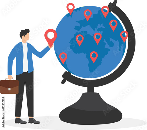 Businessman CEO put new branch pin on world map across globe.Global business expansion, open company branches, franchise in new location to cover all continent, growing business worldwide concept.

