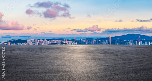 Asphalt road square and city skyline with coastline landscape at sunset in Zhuhai  Guangdong Province  China.
