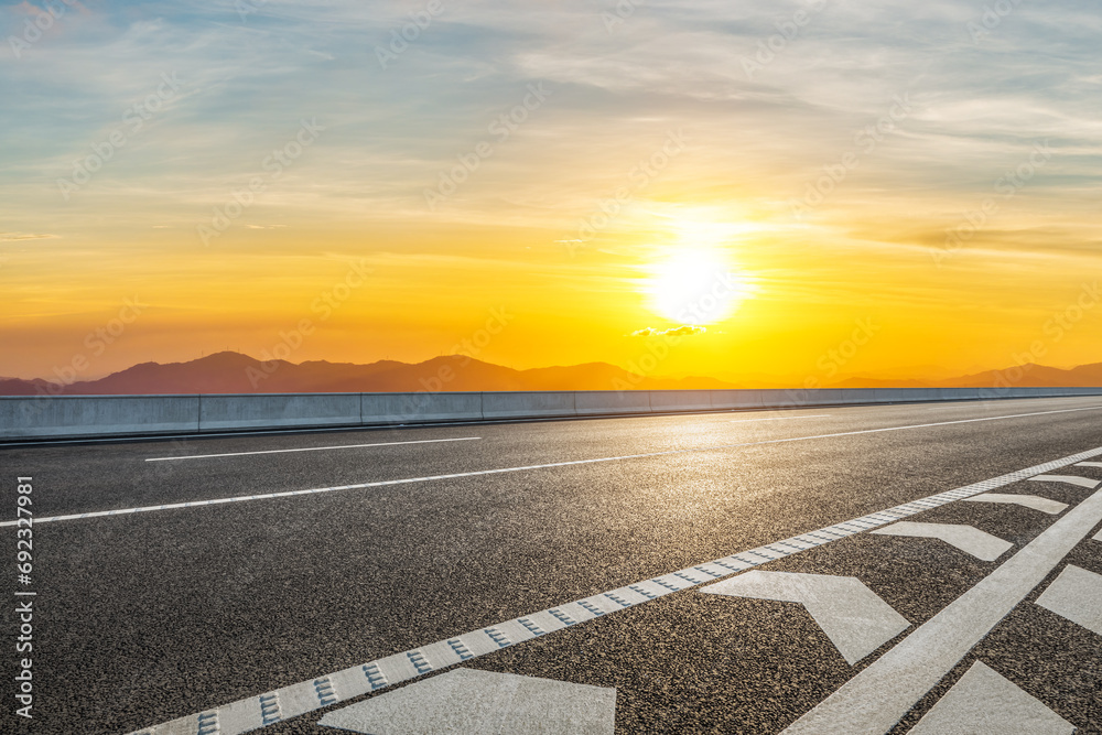 Asphalt highway road and mountain with sky clouds at sunset