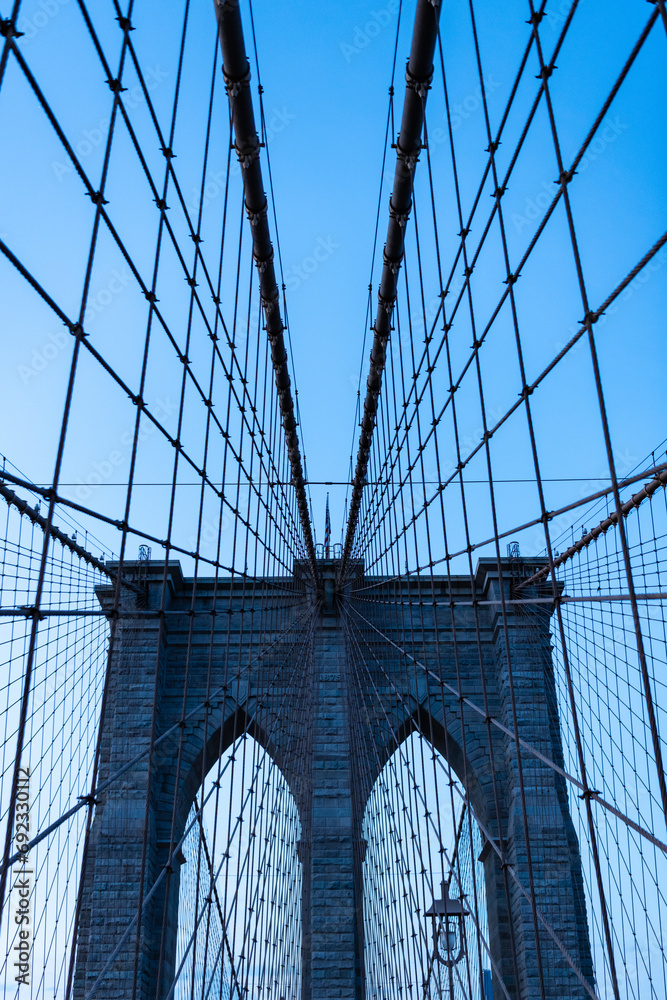 Fototapeta premium Brooklyn bridge in ny, usa. brooklyn bridge in new york. amazing scenery of brooklyn bridge over skyscrapers in metropolis. brooklyn bridge of new york city. Architectural marvel
