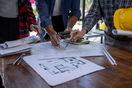Engineer Teamwork Meeting, Architect contractor meetings of real estate brokers and company presidents to select a model to build a housing estate in writing and presenting to state organizations.	 photo