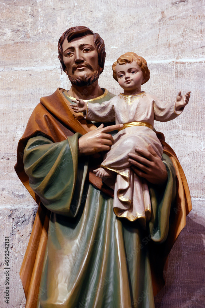  Church of St. Theodule. Saint Josef with infant Jesus in arms. Sion. Switzerland. - obrazy, fototapety, plakaty 