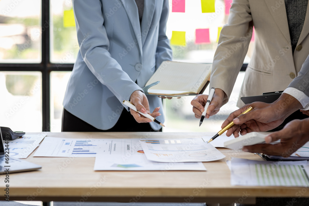 Investment Consultant, Asian business adviser meeting to analyze and discuss the situation on the financial report in the meeting desk office .Financial advisor and accounting concept - obrazy, fototapety, plakaty 