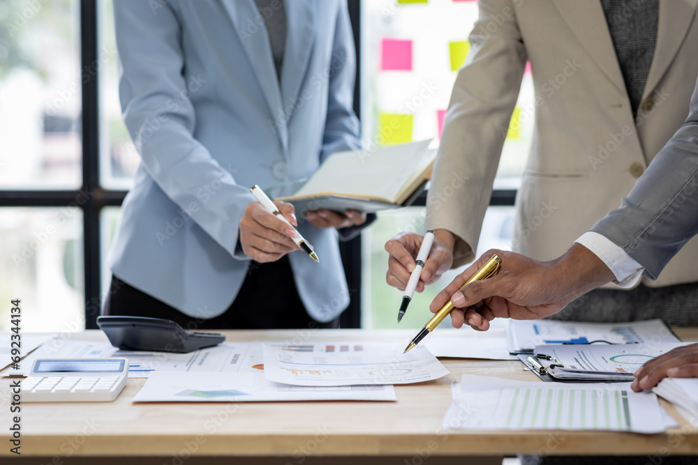 Investment Consultant, Asian business adviser meeting to analyze and discuss the situation on the financial report in the meeting desk office .Financial advisor and accounting concept Investment Consultant, Asian business adviser meeting to analyze and discuss the situation on the financial report in the meeting desk office .Financial advisor and accounting concept