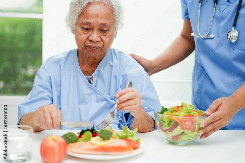 Asian Nutritionist holding healthy food for patient in hospital, nutrition and vitamin. Asian Nutritionist holding healthy food for patient in hospital, nutrition and vitamin.
