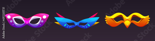 Set of colorful carnival masks isolated on black background. Vector cartoon illustration of masquerade costume elements decorated with color pattern, Venice festival show, traditional art