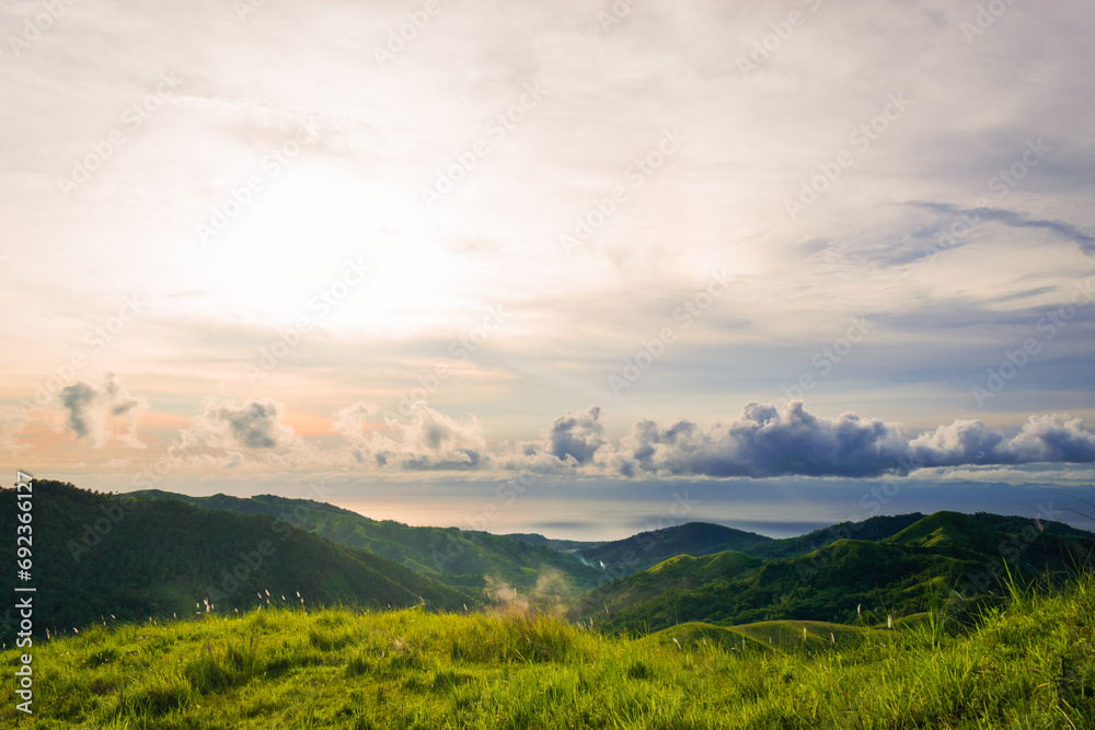 Landscape with mountains and blue sky at sunset. Cabaliwan Peak, Romblon, Philippines.