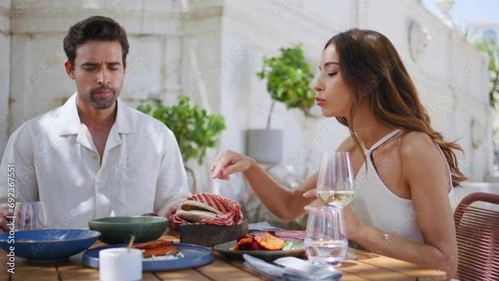 Dating lovers talking cafe table at summer terrace closeup. Couple discussing Dating lovers talking cafe table at summer terrace closeup. Couple discussing