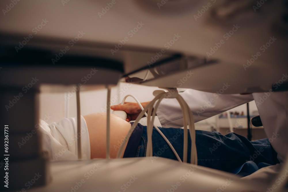 Ultrasound examination of the fetus. Pregnant woman in gynecological