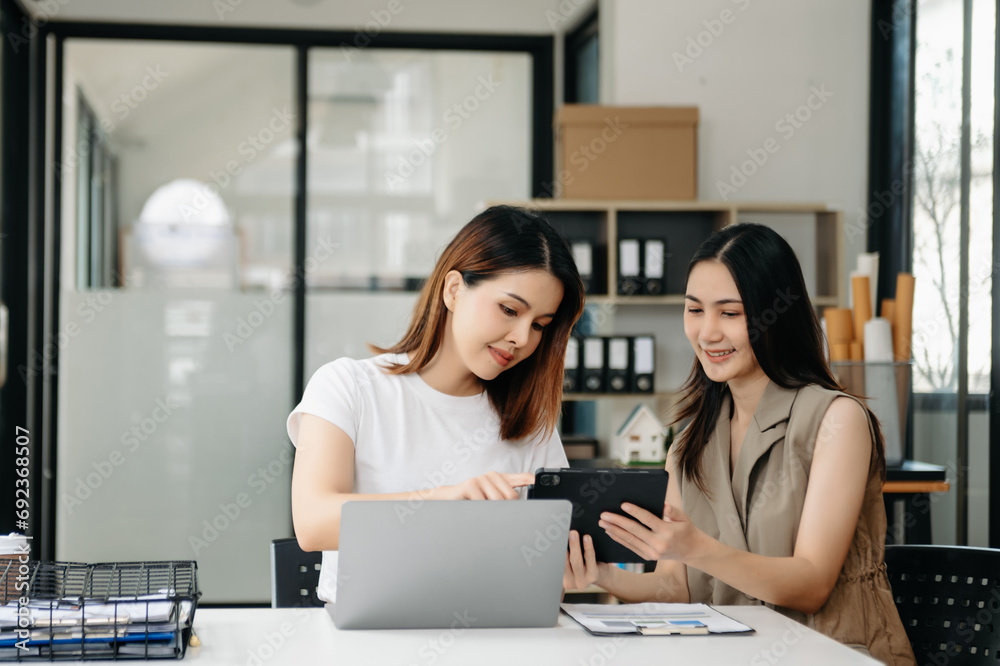 Portrait of success business people working together in office. Couple teamwork startup concept. Portrait of success business people working together in office. Couple teamwork startup concept.