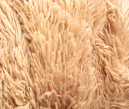 Beige shag carpet as an abstract background. Texture