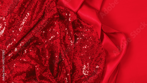 Fabric with sequins as a background. Glitter texture is the trend of the season. Sparkling color red. Abstract pattern wallpaper for the fashion industry.