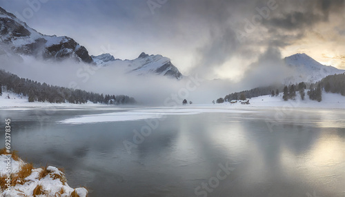 Winter Mist Blanketing the Frozen Champfer Lake, Engadine, Canton of Graubunden, Switzerland photo