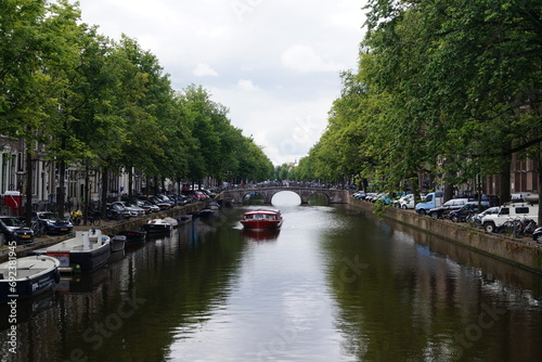 Amsterdam Canal with green trees