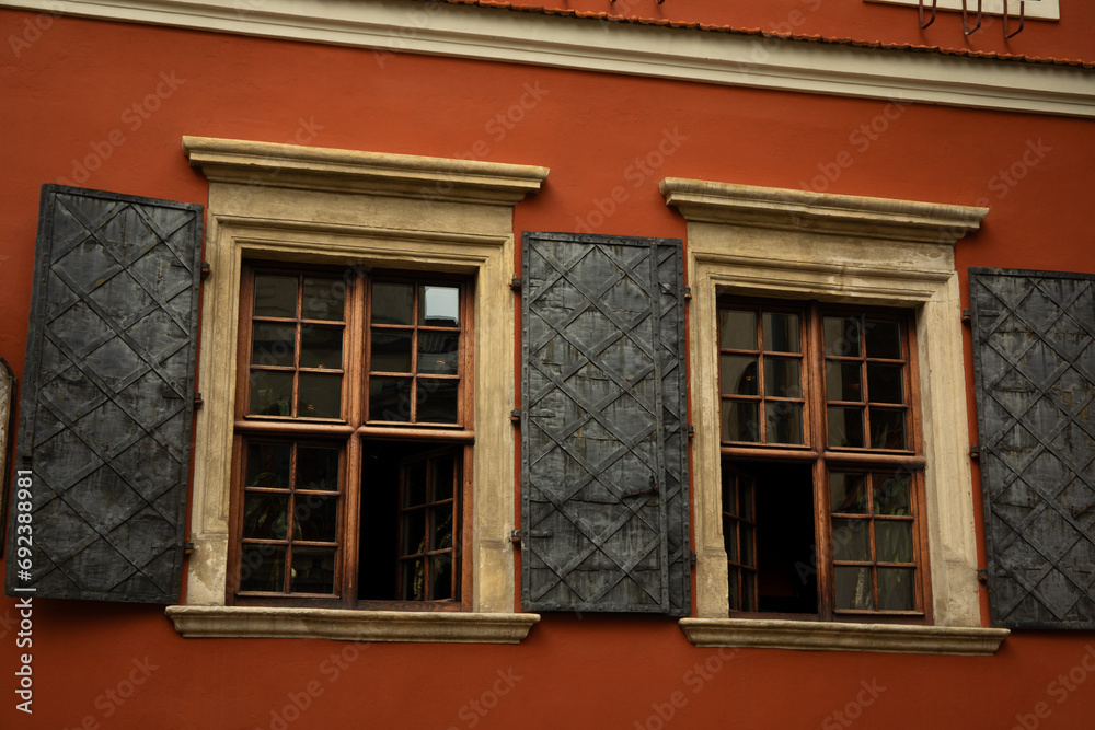 The wall of an old house with windows