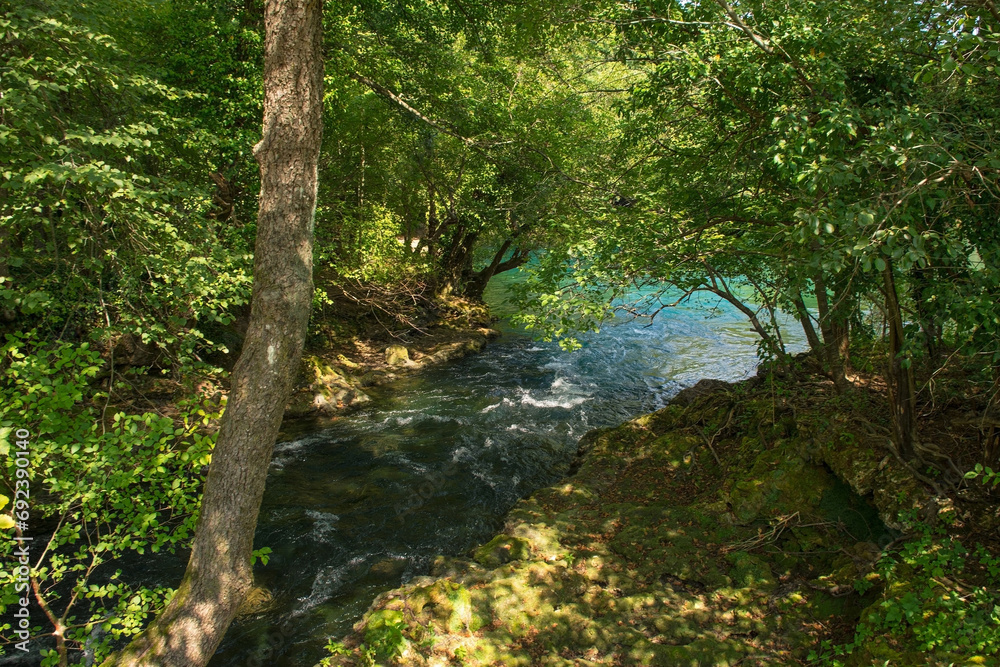 The River Una as it flows through Japod Islands, or Japodski Otoci, near Bihac in the Una National Park. Una-Sana Canton, Federation of Bosnia and Herzegovina The River Una as it flows through Japod Islands, or Japodski Otoci, near Bihac in the Una National Park. Una-Sana Canton, Federation of Bosnia and Herzegovina