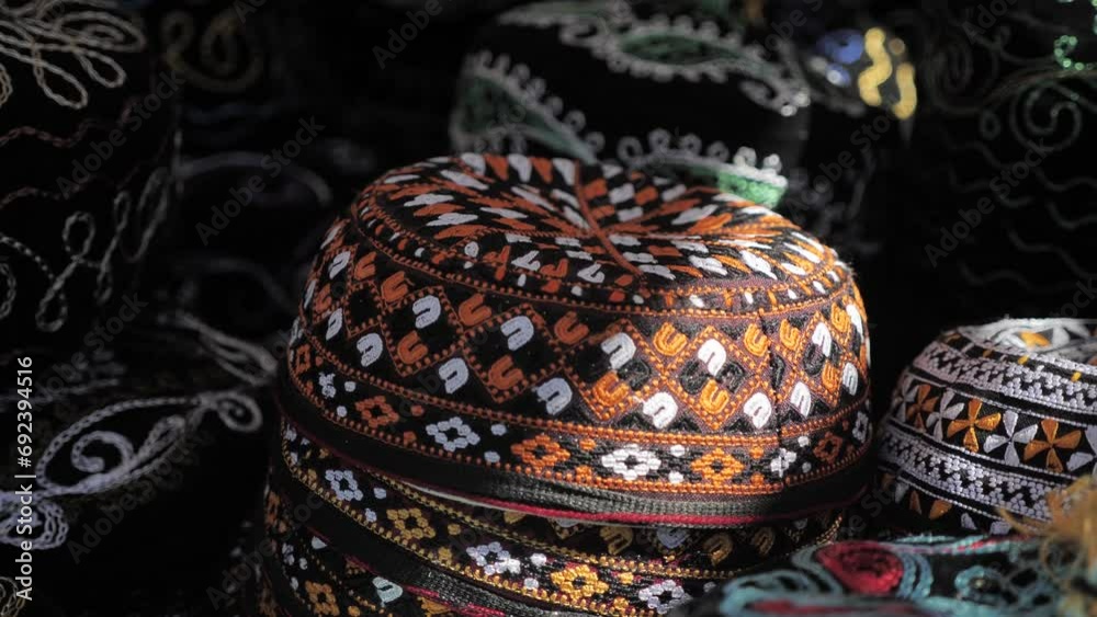 Traditional Uzbek headdress skullcap. Black hat with an embroidered orange pattern. Souvenirs of Central Asia Traditional Uzbek headdress skullcap. Black hat with an embroidered orange pattern. Souvenirs of Central Asia
