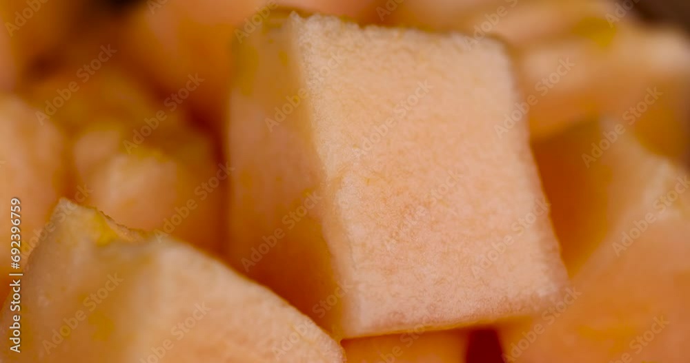 sliced orange melon close-up, delicious soft and ripe food melon on the table sliced orange melon close-up, delicious soft and ripe food melon on the table