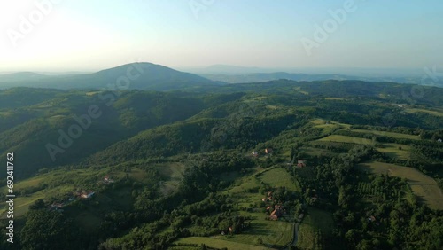 Beautiful aerial landscape of cultivated fields and mountains in countryside photo