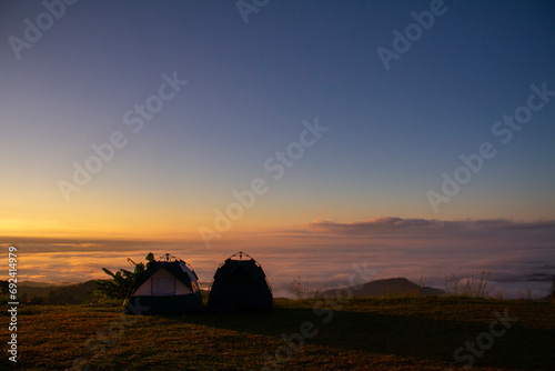 Two camp on  the mountain see view sea of mist and sunsine in the morning. photo