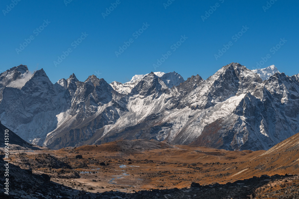 View from Cho La pass to the west to the mountains of the Gokyo Valley Kyaio Ri, Panayo Tippa, Tengkangboche. EBC Everest bace camp or Three passes trekking in Sagarmatha, Khumjung, Nepal.