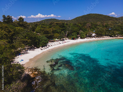 Koh Samet Island Thailand, aerial drone view from above at the Samed Island in Thailand with a turqouse colored ocean and a white tropical beach from above drone view