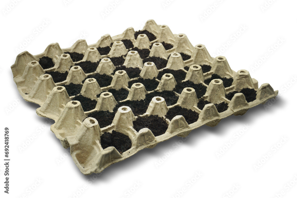 An empty egg box for safe transport of eggs, which makes it safe to break, is separated on a white background. An empty egg box for safe transport of eggs, which makes it safe to break, is separated on a white background.