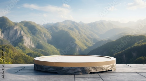 Podium, a stone platform for product display, with a mountain view background. © venusvi