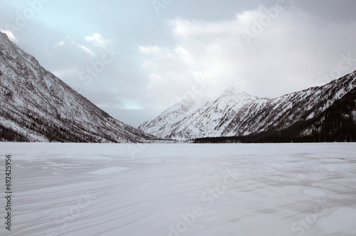 Snow-covered winter mountain lake, Russia, Siberia, Altai mountains. Multinskie lakes. photo