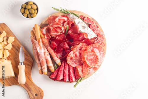 Charcuterie board. Antipasti appetizers of meat platter with salami, prosciutto crudo or jamon and olives.